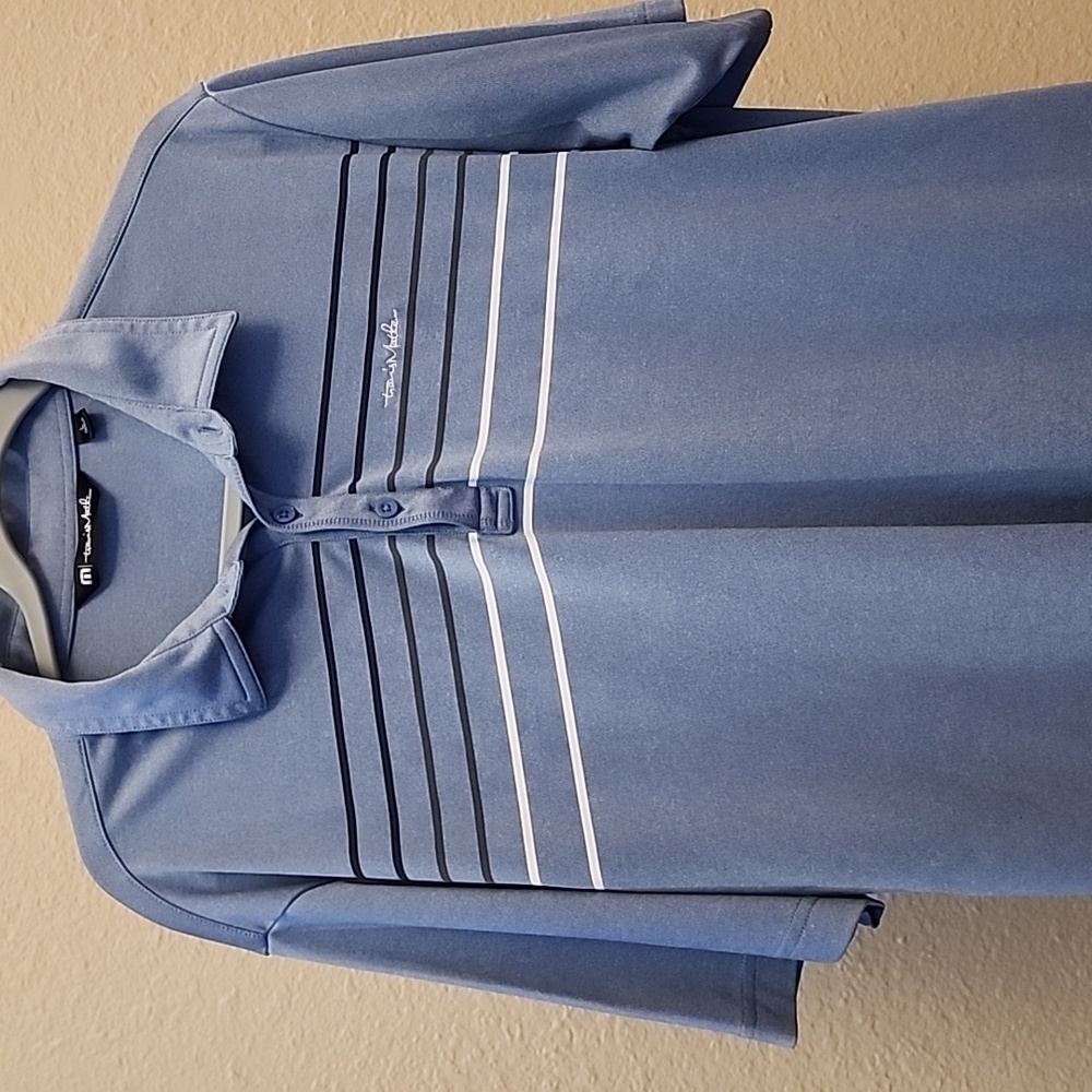 Travis Mathew Blue Polo Shirt with Modern Stripes